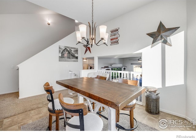 dining space with light colored carpet and a notable chandelier