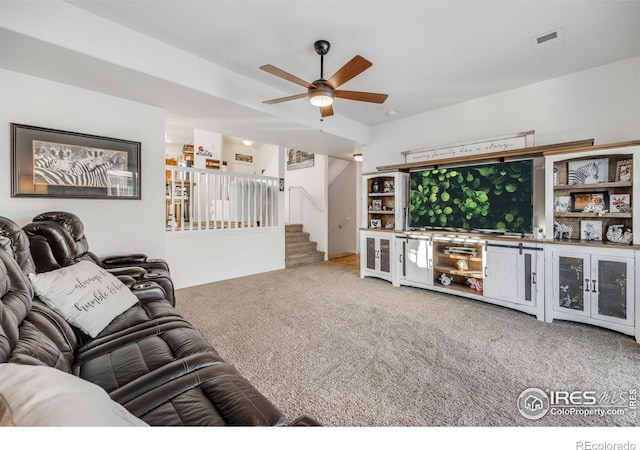 living room with carpet floors and ceiling fan