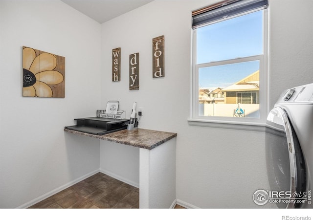 clothes washing area featuring washer and dryer