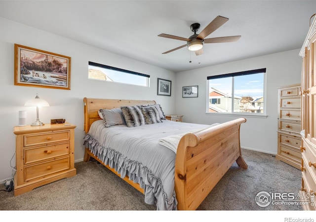 bedroom featuring light carpet and ceiling fan