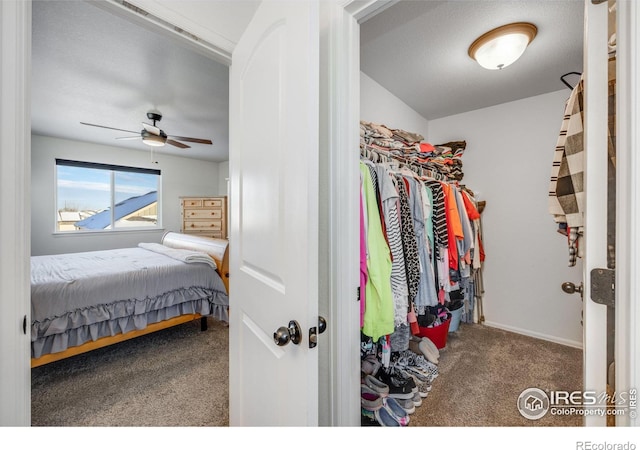 interior space with carpet flooring and ceiling fan