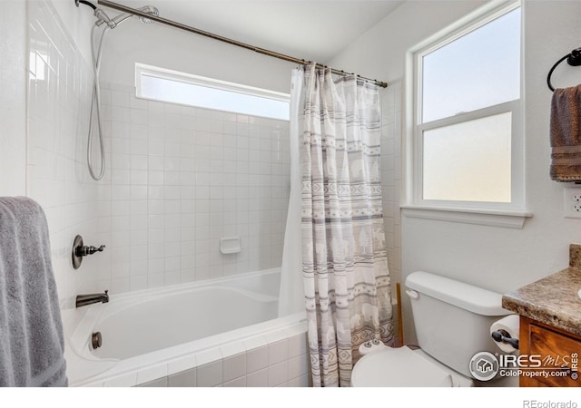 full bathroom with vanity, toilet, a healthy amount of sunlight, and shower / tub combo