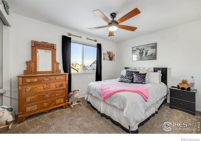 carpeted bedroom with ceiling fan