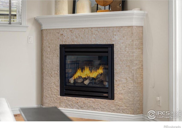 interior details with a tile fireplace