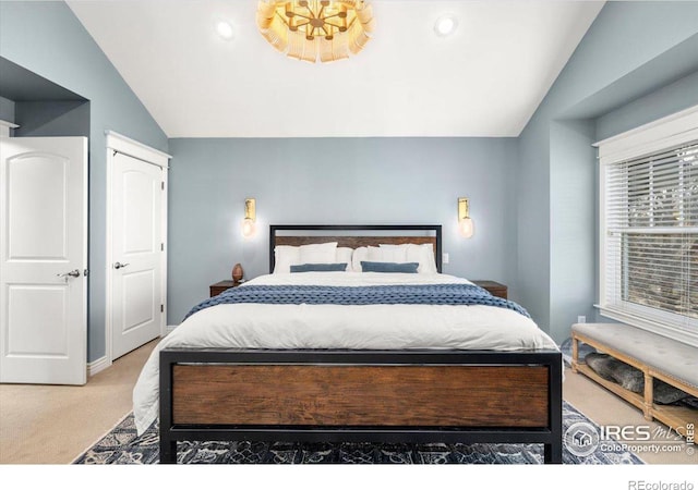 carpeted bedroom featuring vaulted ceiling