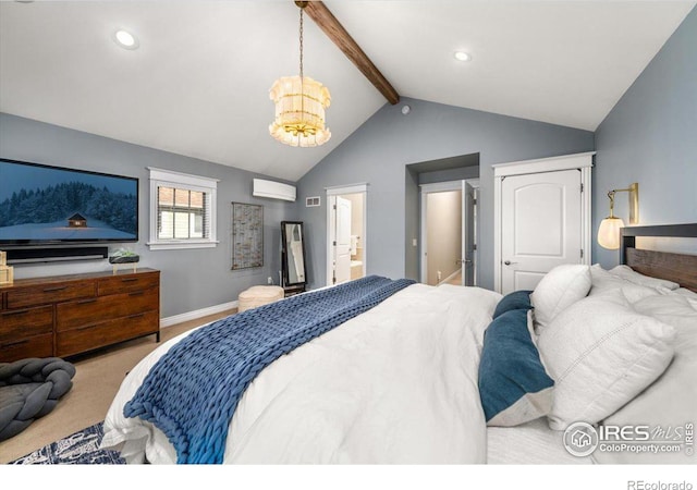 carpeted bedroom with a chandelier, a wall mounted AC, vaulted ceiling with beams, and ensuite bath