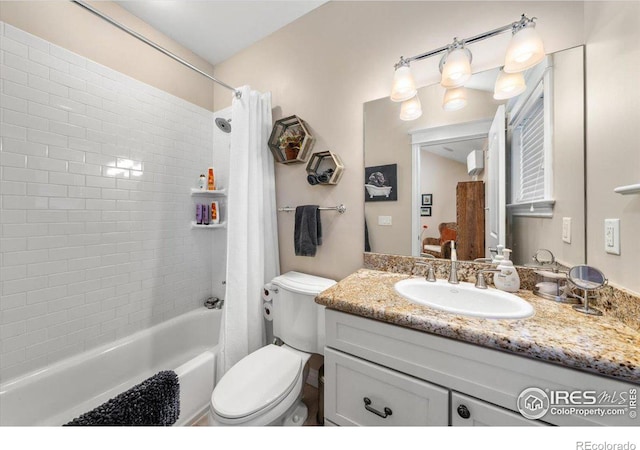 full bathroom featuring vanity, toilet, and shower / tub combo with curtain