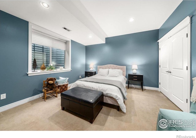 bedroom with light colored carpet