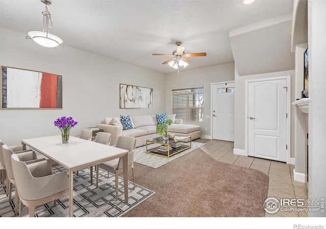 living room featuring light tile patterned floors and ceiling fan