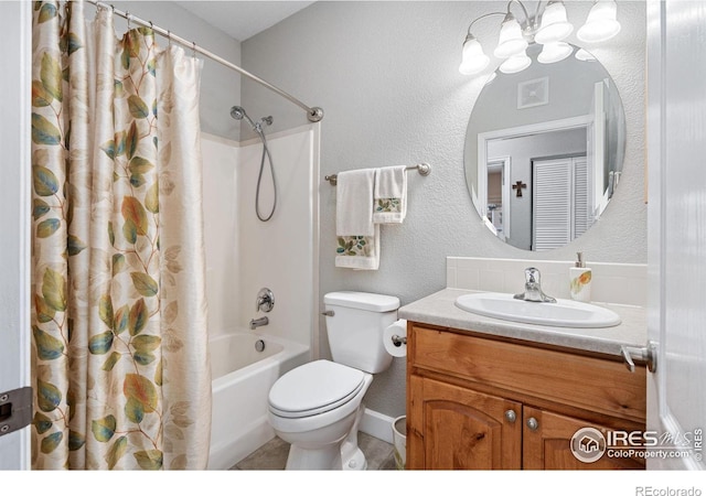 full bathroom featuring toilet, vanity, and shower / tub combo