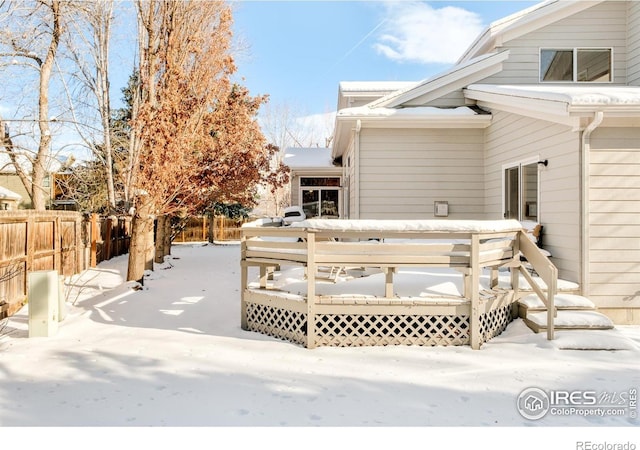 view of snow covered deck