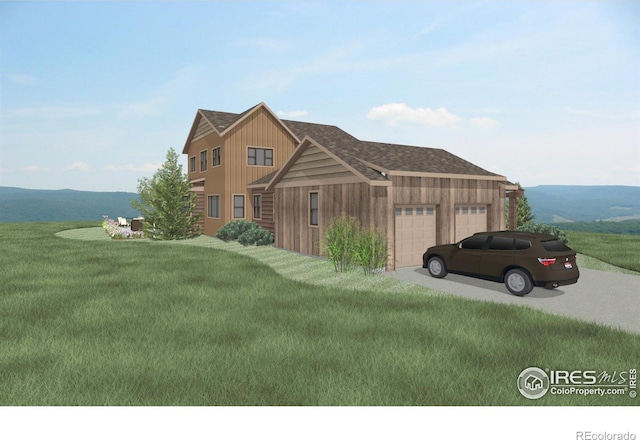 view of front facade featuring a garage, a mountain view, and a front lawn