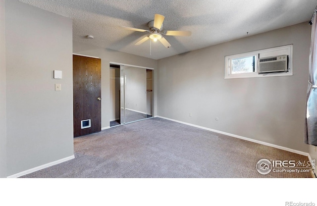 unfurnished bedroom featuring carpet floors, a textured ceiling, ceiling fan, and a closet