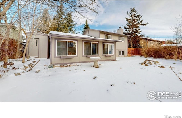 view of snow covered house