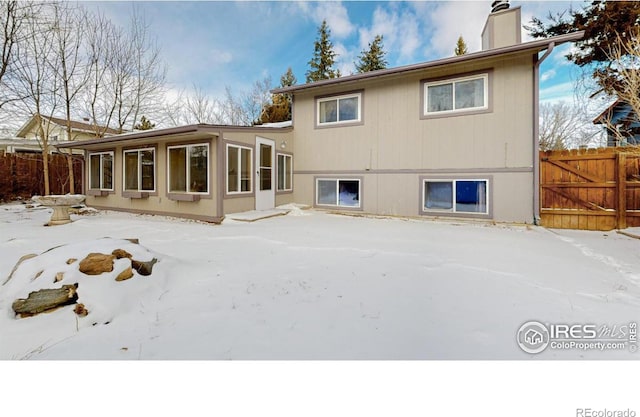 view of snow covered property