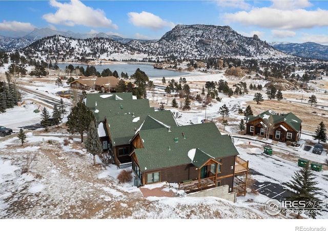 snowy aerial view with a mountain view