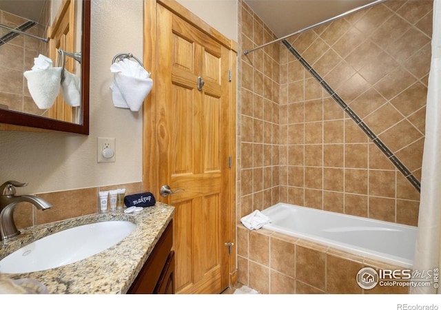 bathroom with vanity and shower / bath combo