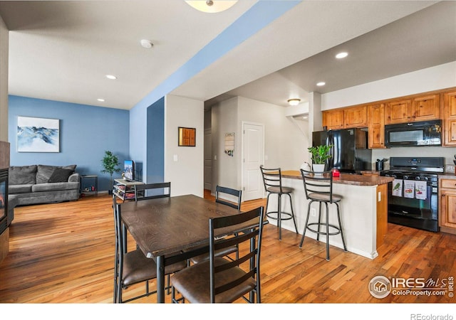 dining area with light hardwood / wood-style floors