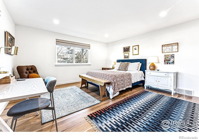 bedroom featuring hardwood / wood-style floors