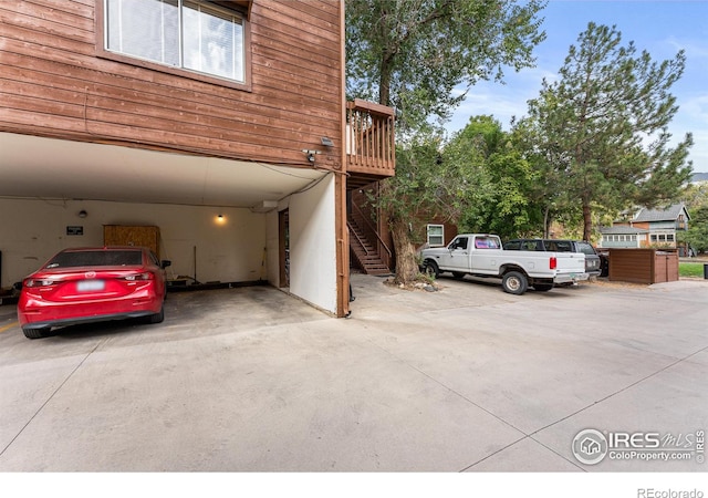 view of vehicle parking featuring a carport