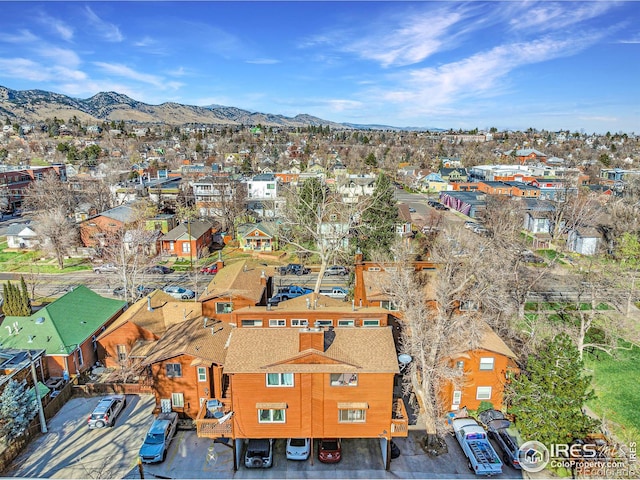 birds eye view of property featuring a mountain view