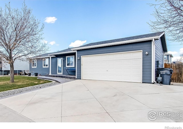 ranch-style home featuring a garage