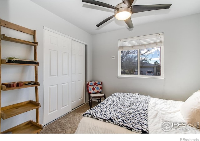 carpeted bedroom featuring ceiling fan and a closet