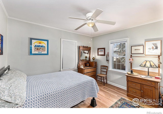 bedroom featuring crown molding, ceiling fan, and light hardwood / wood-style floors