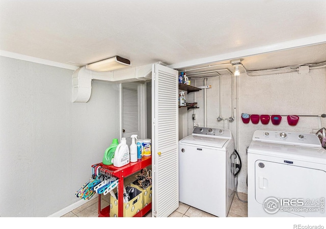 washroom featuring light tile patterned flooring and separate washer and dryer