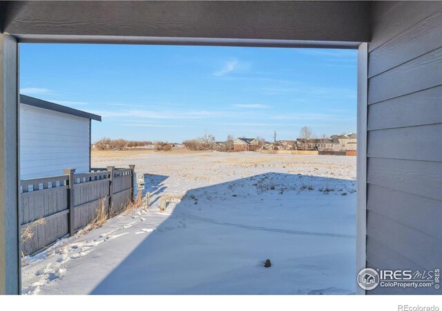 view of yard covered in snow