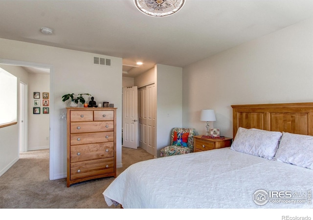 carpeted bedroom with a closet