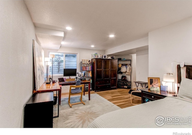 bedroom with light hardwood / wood-style flooring