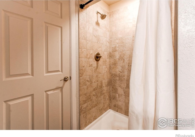 bathroom with a shower with curtain