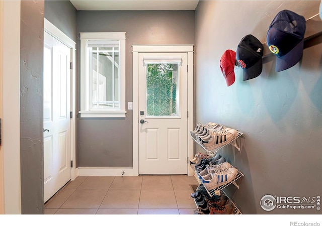 entryway featuring light tile patterned flooring