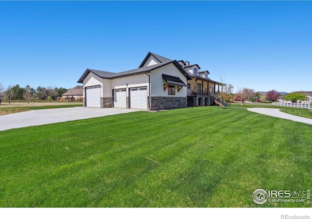 view of front of home featuring a garage and a front lawn