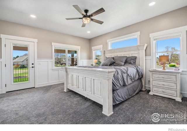 bedroom featuring ceiling fan, access to exterior, and dark colored carpet