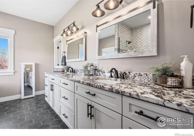 bathroom with tile patterned floors and vanity