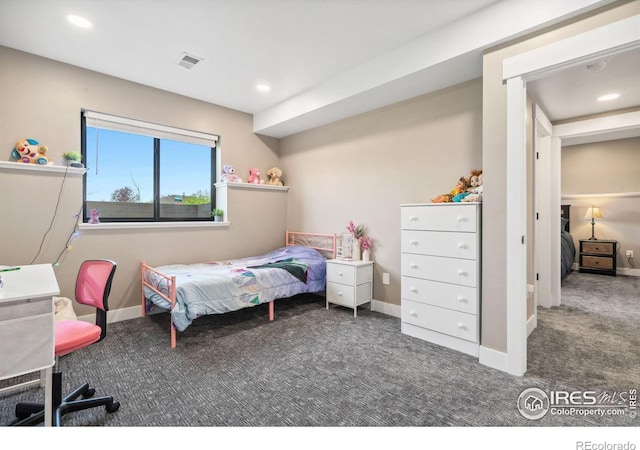 bedroom featuring dark carpet