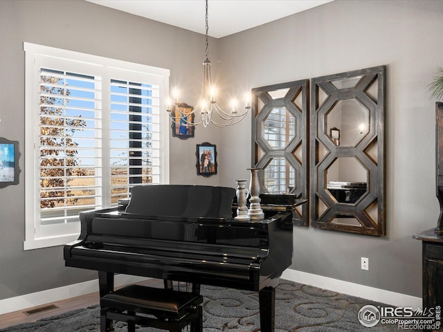 misc room with an inviting chandelier