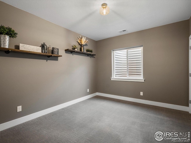 empty room featuring carpet floors