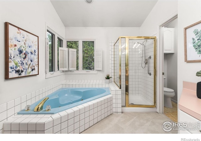 bathroom with shower with separate bathtub and toilet