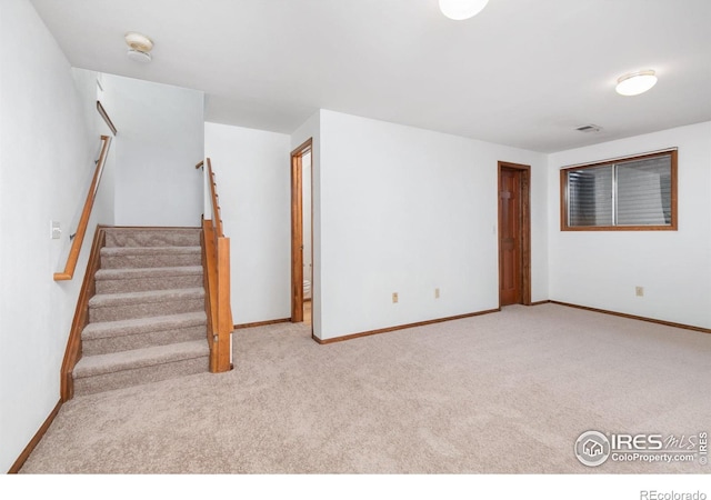 interior space featuring light colored carpet