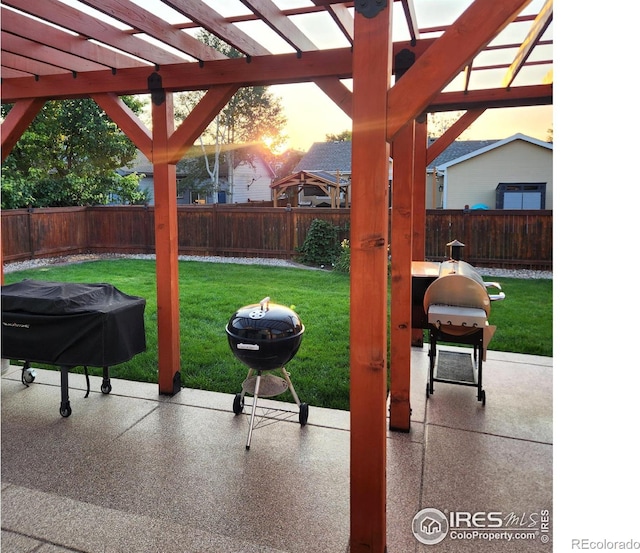 view of patio / terrace with grilling area and a pergola