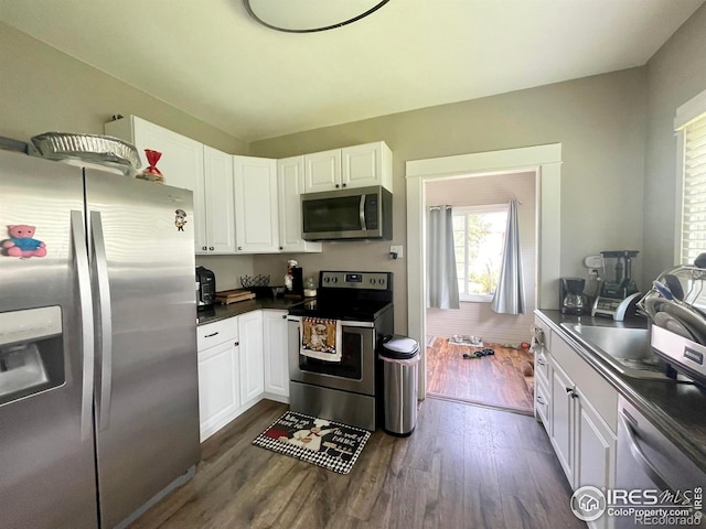 kitchen with stainless steel appliances and white cabinets