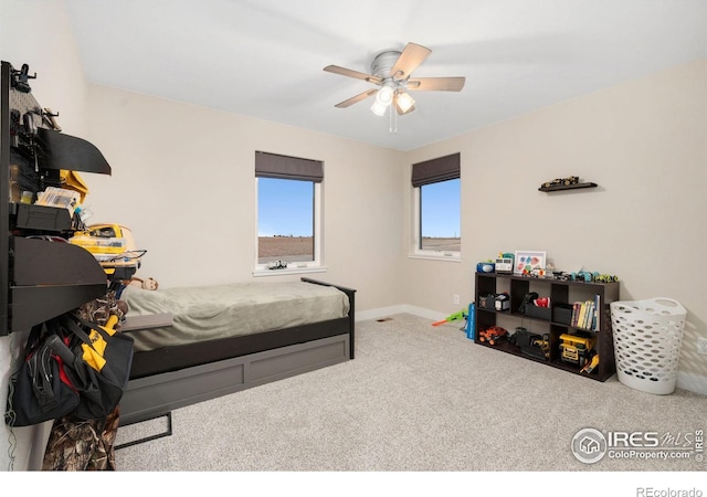 carpeted bedroom with ceiling fan