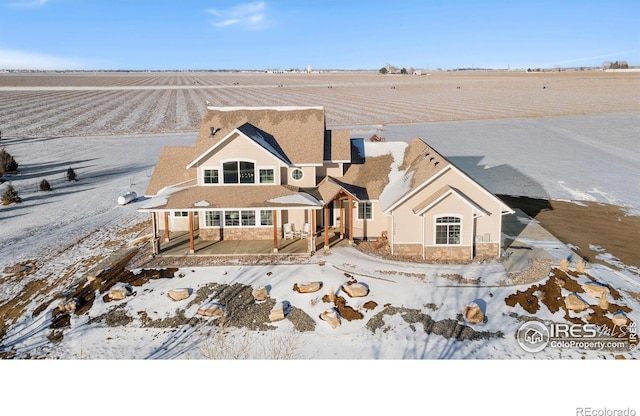 view of front facade featuring a rural view