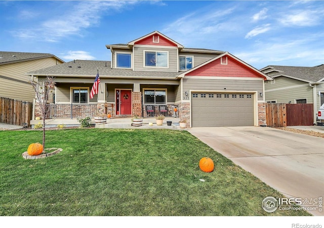 craftsman house with a porch, a garage, and a front lawn