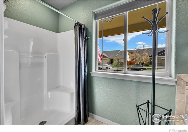 bathroom featuring curtained shower