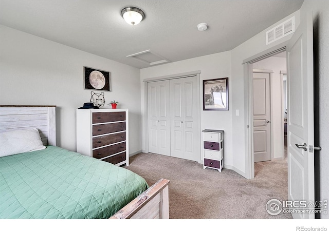 carpeted bedroom featuring a closet