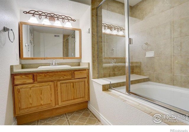 bathroom with vanity, combined bath / shower with glass door, and tile patterned floors